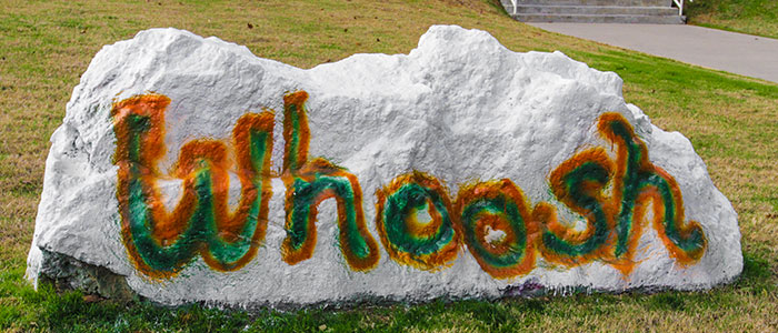 The word 'Whoosh' painted on the UTD spirit rock.